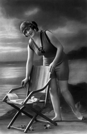 A bather wearing bathing suit, postcard, c; 1910