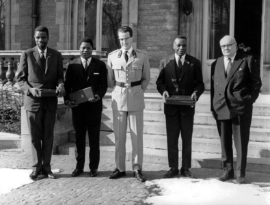Mr Adoula Prime Minister of Congo, with Mr Bomboko ministre of foreign Affaires and Mr Bamba minister of finances, during official visit in Brussels here with King  Baudouin and Mr Spaak. Mr Adoula received the Medal of the Order of the Crown February 26, 1963