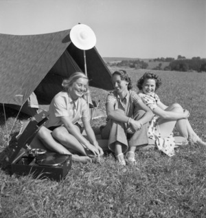 Young woman by their tent on summer vacation, Germany 1930s (b/w photo)