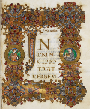 Opening of St John's Gospel. Text beginning with initial 'I', acanthus leaf pattern with interlace knotwork terminals adorned with birds heads holding leaf-sprays in their beaks. Borders of 'Winchester' type acanthus with corner bosses and two roundels with bust figures
