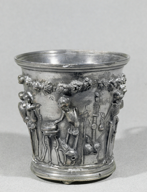 Clotho on a column with skull and baton …