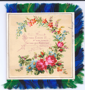 A Victorian Christmas Card of a garland of roses and flowers, edged with a green and blue silk fringe, circa 1880 (coloured lithograph)