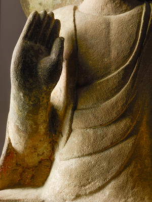 Detail of hand of Buddha in abhaya mudra on a stone sculpture in collection of Robert…, 2015 (photo)