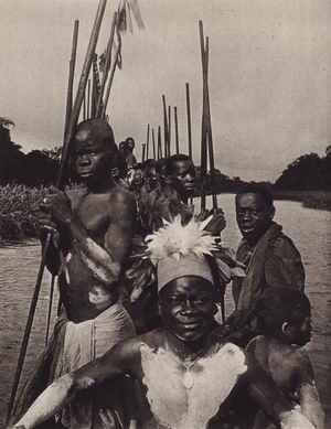 Mungamba, Bantu chief, travelling in his canoe, Belgian Congo (b/w photo)