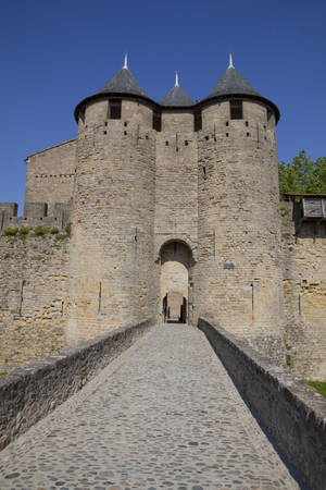 Bridge over the moat and entrance to the castle, Carcassonne, France (photo) 