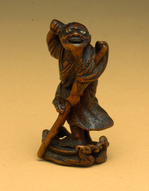 Japanese katabori-style netsuke - Sanfushi, a wise and immortal hermit or Sennin (boxwood & mother of pearl)