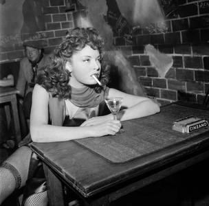 Shooting of film "Boite de nuit" at the Studio de Boulogne, Paris, January 4, 1951 : French actress Claudine Dupuis (as a cabaret dancer) (b/w photo)