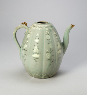 Melon-Shaped Ewer with Stylized Floral Scrolls (stoneware with celadon glaze & underglaze inlaid decoration of black & white clays, with gold repair)