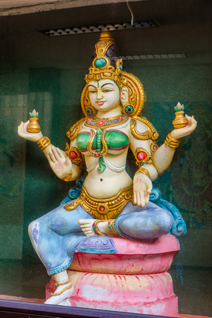 Thaipusam Festival: Statue of four-armed goddess at Sri Maha Mariamman Temple, Kuala Lumpur, Malaysia