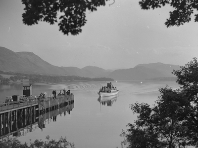 A steamboat nears a jetty on Ullswater, 1930s-60s (b/w photo)