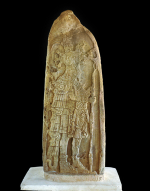 Stone stele depicting Mayan ruler Kan Boar holding staff or spear. Maya classic era (stone)