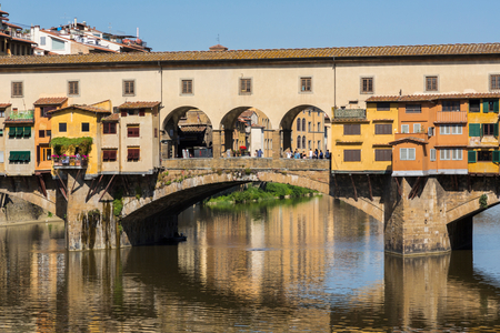 Florence, Tuscany, Italy.  The medieval Ponte Vecchio, or Old Bridge, on the Arno River. (photo)