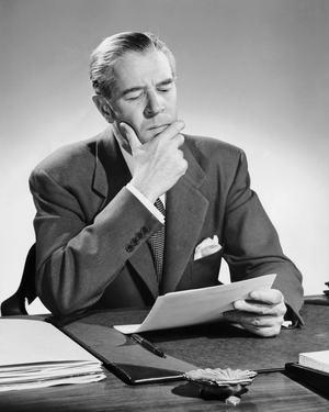 Businessman reading a document in an office