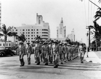 Soldiers march in formation on Collins Avenue in Miami Beach, c.1943 (b/w photo)