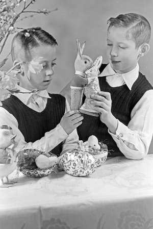 Two boys at a table with easter decoration, Germany 1930s (b/w photo)