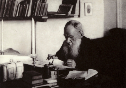 L N Tolstoi working in his study, Yasnaya Poliana, 1909 (b/w photo)