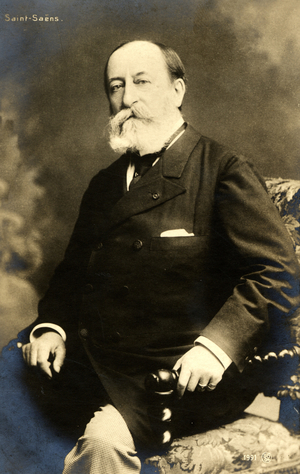 Camille Saint-Saens sitting on