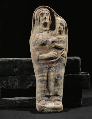 Woman with a child in her arms …