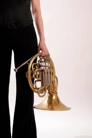 French Horn player holding