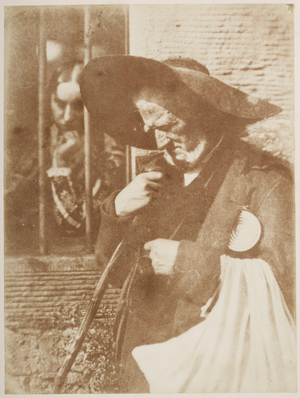 Edie Ochiltree (John Henning) and Miss Warden, Bonaly. Half-length portrait of John Henning (1771-1851) as the beggar Edie Ochiltree from Scott's 'The Antiquary' wearing a wide-brimmed hat and carrying a staff. Mrs Elizabeth Cleghorn as Miss Warden looks out at him through a barred window at the top left.