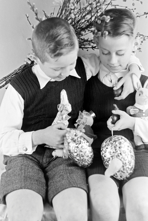 Two boys at a table with easter decoration, Germany 1930s (b/w photo)