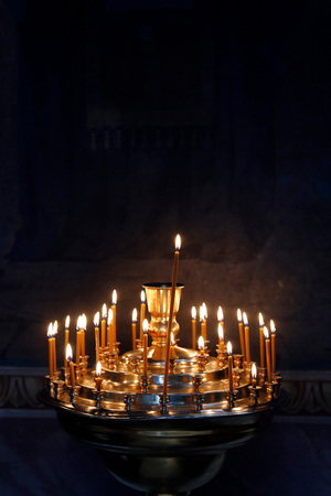 Candles in Capriana monastery church, Moldova (photo)