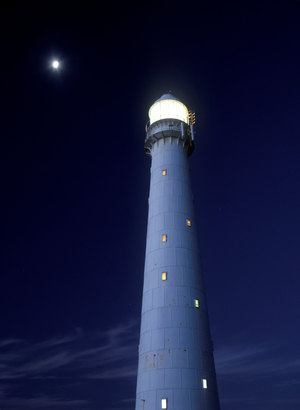 Moon above lighthouse at dusk, Kommetjie, Cape peninsula, Cape Town, South Africa (photo)