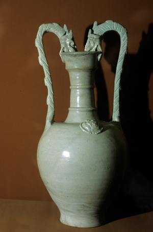 Vase with white glaze, double dragon handles, decorated with flowers in relief on the belly, 618-907