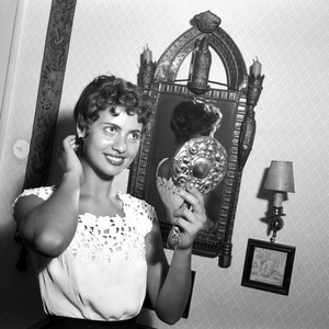 German Schlager singer Margot Eskens with a mirror, Germany 1955