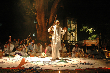 A Baul (Folk singer) performs in an open stage on March 31, 2005 in Dhaka, Bangladesh. Folk song is very popular and part of culture in Bangladesh.  (photo)