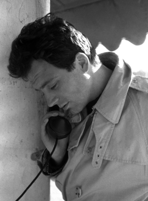 Ostia, Rome, Italy, 1960, The actor Franco Interlenghi on a public phone (b/w photo)