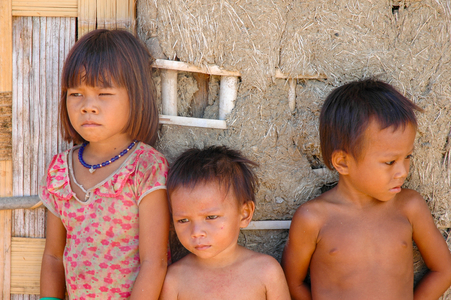 Cham culture: Young Cham children beside mud hut, village near Phan Rang, Vietnam.