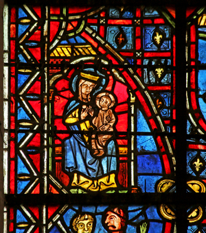 A statue of the Virgin Mary (stained glass)