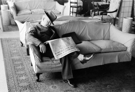 Man asleep in hotel lobby, Taylor, Texas, 1939 (b/w photo)