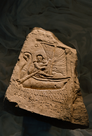 Limestone funerary stela showing the deceased, a young boy, reclining in a boat, Roman Period…, 2002 (photo)