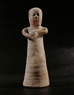 Woman holding a round object. Clay figurine (clay)