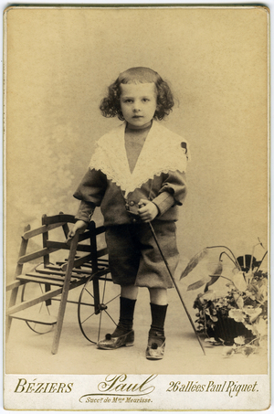 Portrait of a Little Boy Supporting a Small Dog Cart, c.1904 (photo)