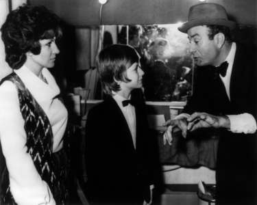 French Comedian Fernand Raynaud With Is Wife Renee Caron and Son Pascal at Premiere of his Show at The Olympia in Paris on December 31, 1970 (b/w photo)