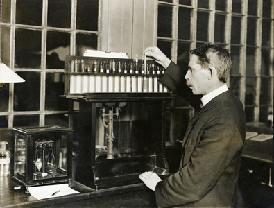 A man in a laboratory estimating carbon in a sample of steel, Crewe Locomotive Works, Forge Street, Crewe, Cheshire, UK, 1910 (b/w photo)