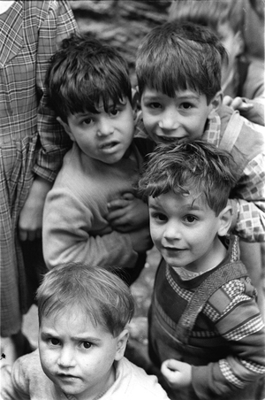 Group of children in Scalilla Courtyard, Palermo, Sicily, Italy, 1957 (b/w photo)