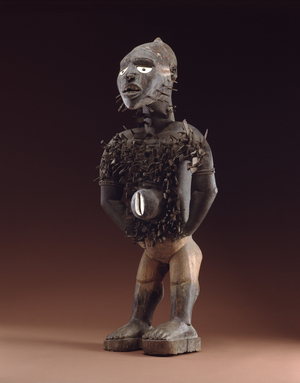 Nail Figure (nkisi n'kondi) Yombe, Congo c.1875 (wood with screws, nails, blades & cowrie shells)