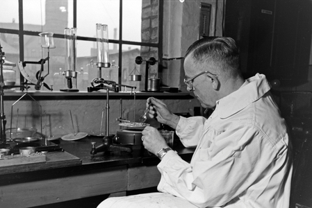 At the laboratories of the technical centre for tinned food at Magdeburg, Germany 1930s (b/w photo)