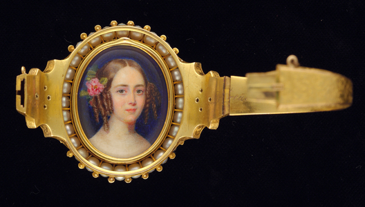 A bracelet set with two portrait miniatures of Ladies, possibly sisters, one with her hair curled, the other with a rose in her hair (w/c on ivory)