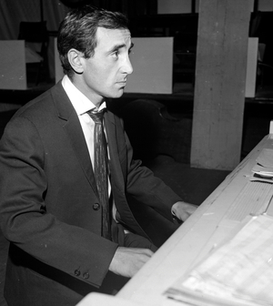 French singer Charles Aznavour at home, 1960  (b/w photo)