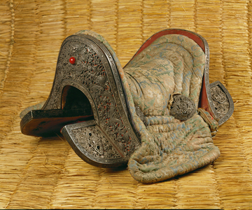 Part of the tack for the royal horse, this saddle is embellished with gold-plated silver intricately worked in tendrils, dragon, phoenix and jachung