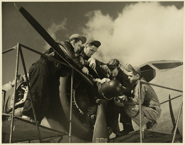 Film still: aviators around the propellor of an aircraft, 1942-1945 (photo)