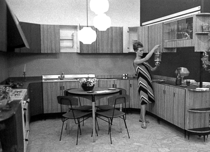 Naples, Italy, 1963, The actress Ilaria Occhini in the kitchen (b/w photo)