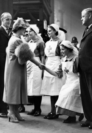 Queen Elizabeth visits a casualty evacuation train in London, 1939 (b/w photo)