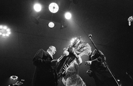 Winner gets flowers on stage as 7,800 bingo players participate in Victoria Kinsmen..., 1961 (photo)