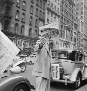 Vendor selling 'Social Justice' on the street in New York City, 1939 (b/w photo)